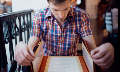 A man reading a menu